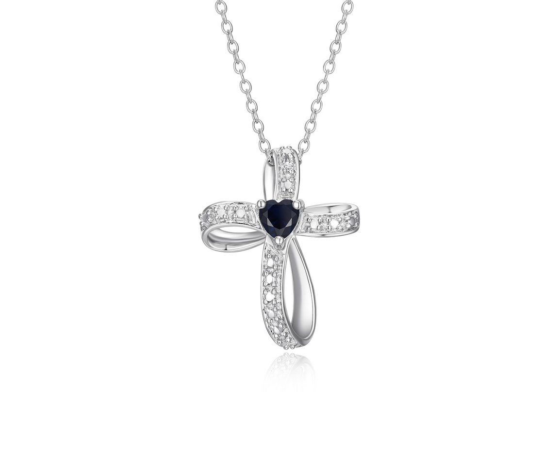 DÉLICATE CROIX EN ARGENT RHODIÉ SERTIE D'UN SAPHIR SYNTHÉTIQUE TAILLE EN COEUR ET CUBIQUES ZIRCONIAS - PJ R3A3UK19FW - REIGN