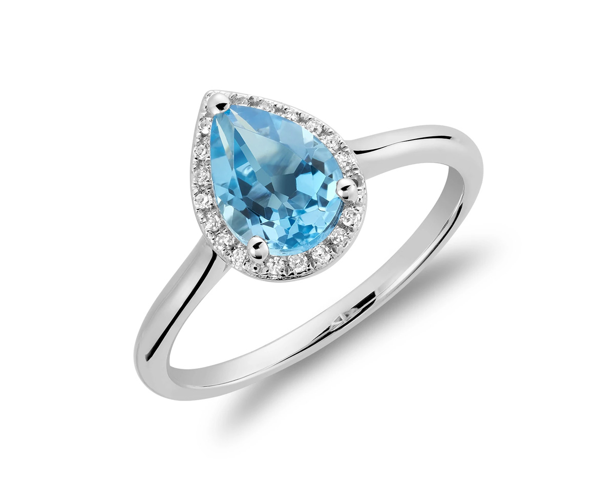 BAGUE EN OR 10K BLANC SERTIE D'UN TOPAZE BLEU ET DE DIAMANTS